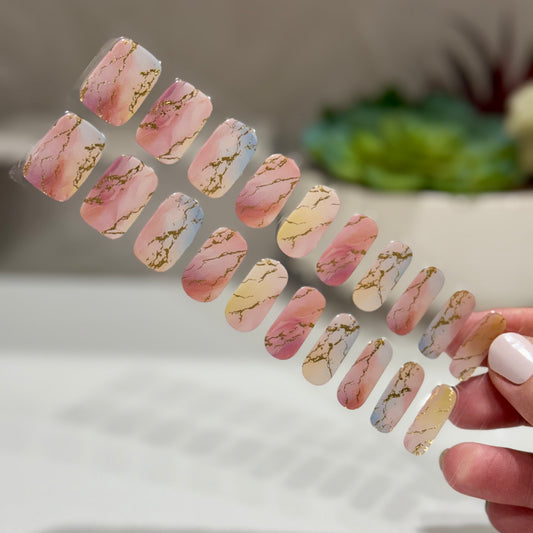 semicured gel nails in pink, blue and gold sunset dream shade